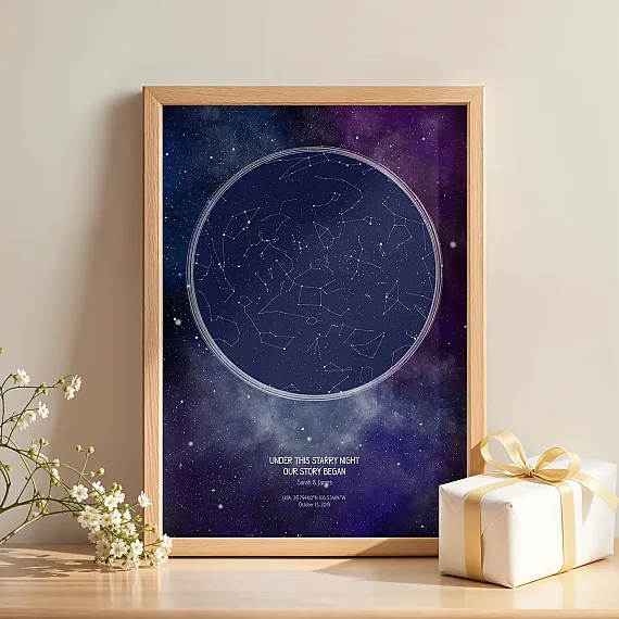 Personalized star map poster displayed on a table next to a wrapped gift and flowers.