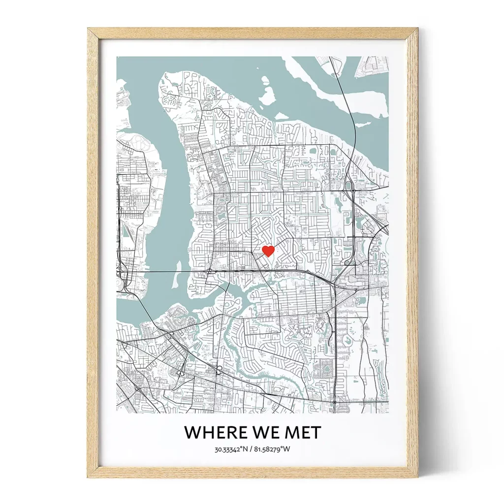Framed Where We Met map print with a pale blue city map, red heart marker and personalized coordinates